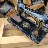 Old Singer sewing machine on pedestal