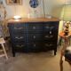 Black and wood chest of drawers