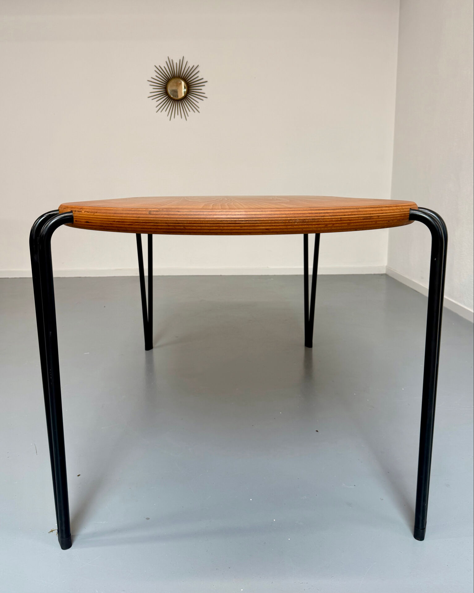 Solid wood dining table with tubular legs, 1980s postmodern design.