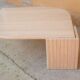 Table basse vintage en travertin par les éditions Roche Bobois