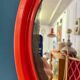 Round orange mirror Gilac for Prisunic