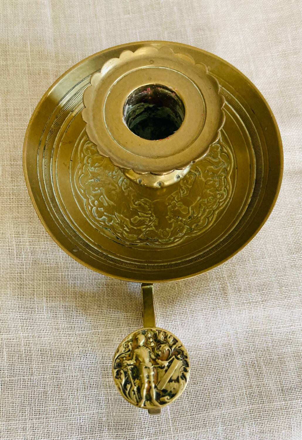 20th century chiseled brass socket candle holder representing Horsemen in armor