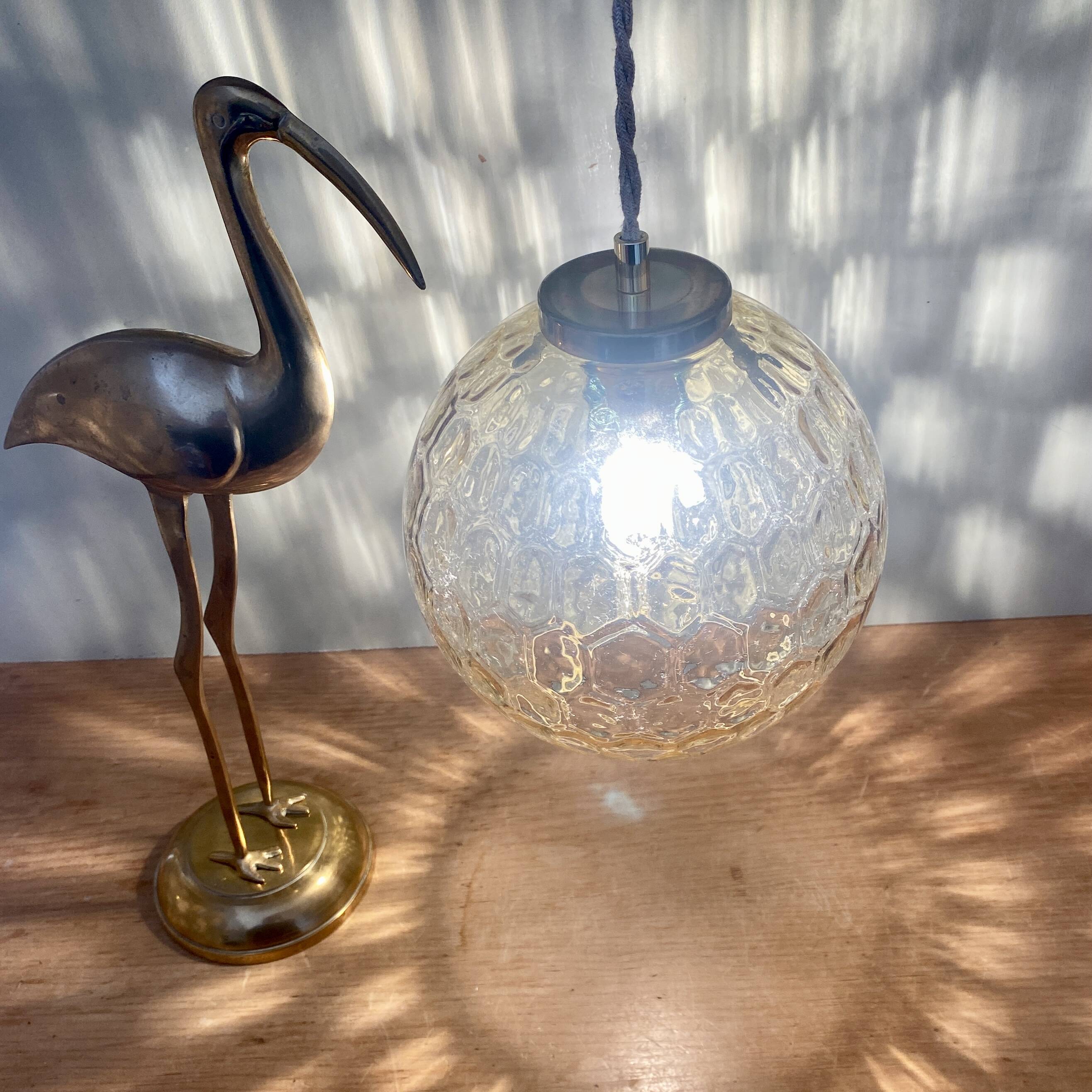 Vintage globe pendant light in amber glass