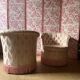 Pair of Hollywood Regency style cabriolet armchairs in satin pink, 1970s.