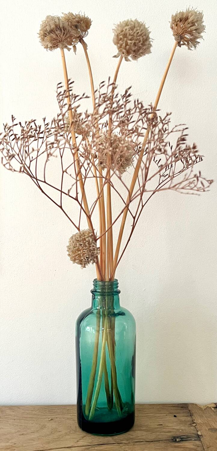 Small vintage dark turquoise blue bottle