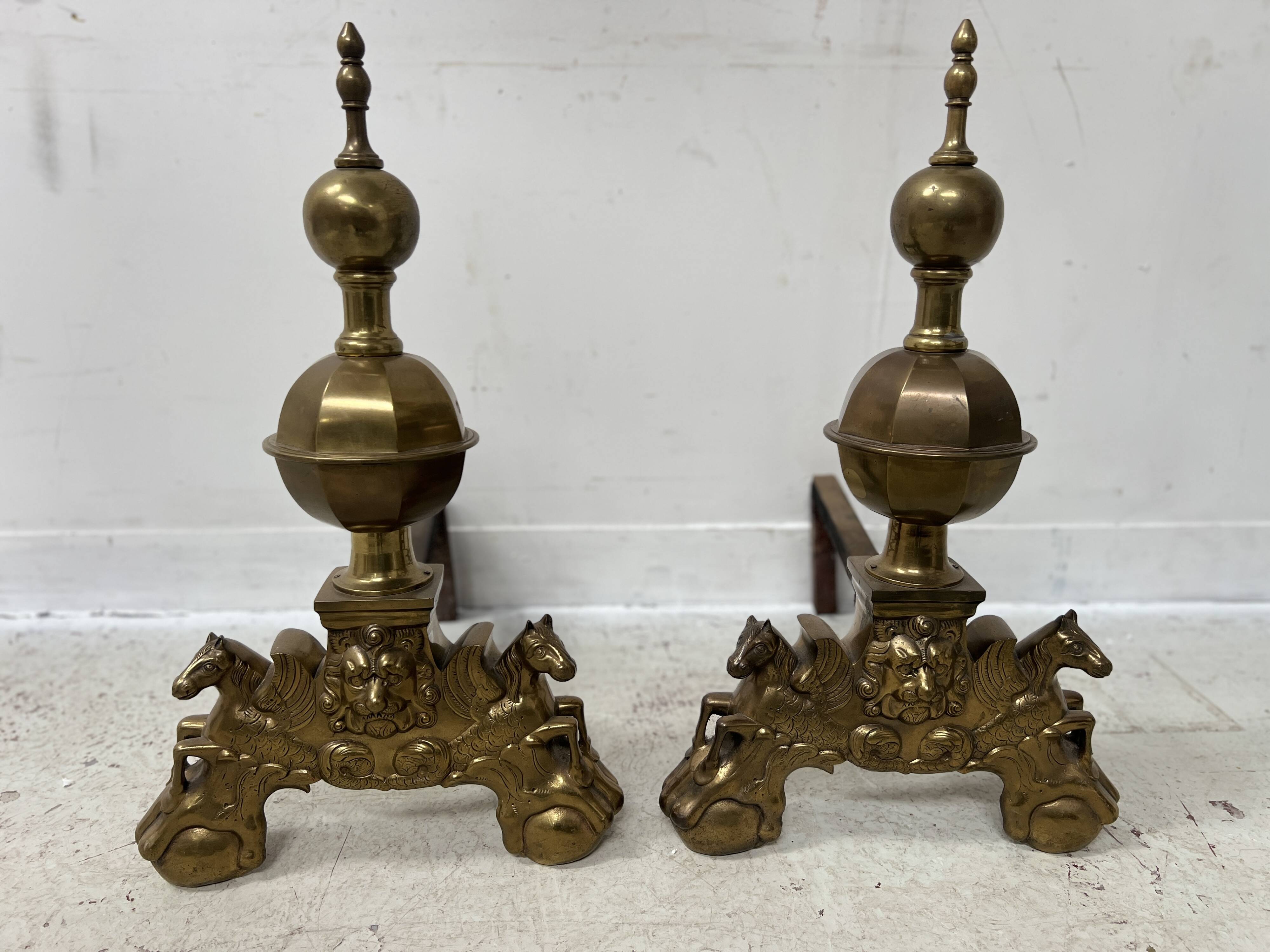 Important pair of brass log holders from the 20th century.