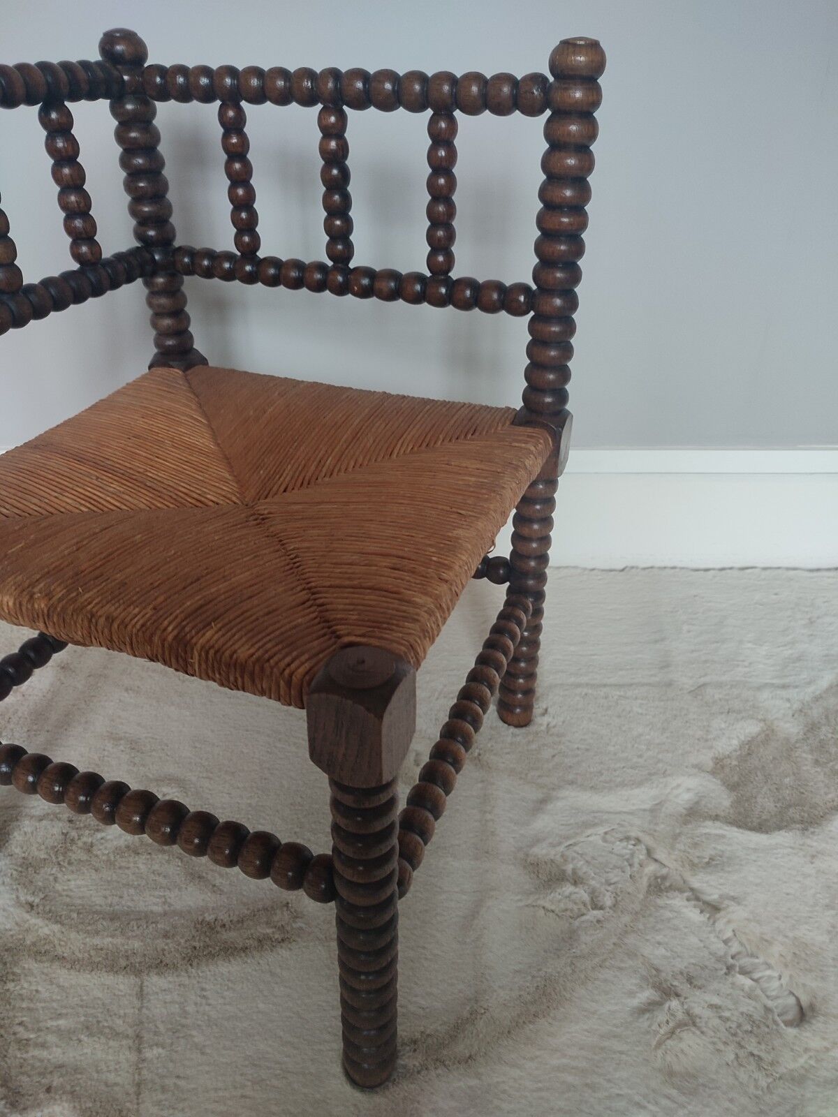 Turned wooden corner chair
