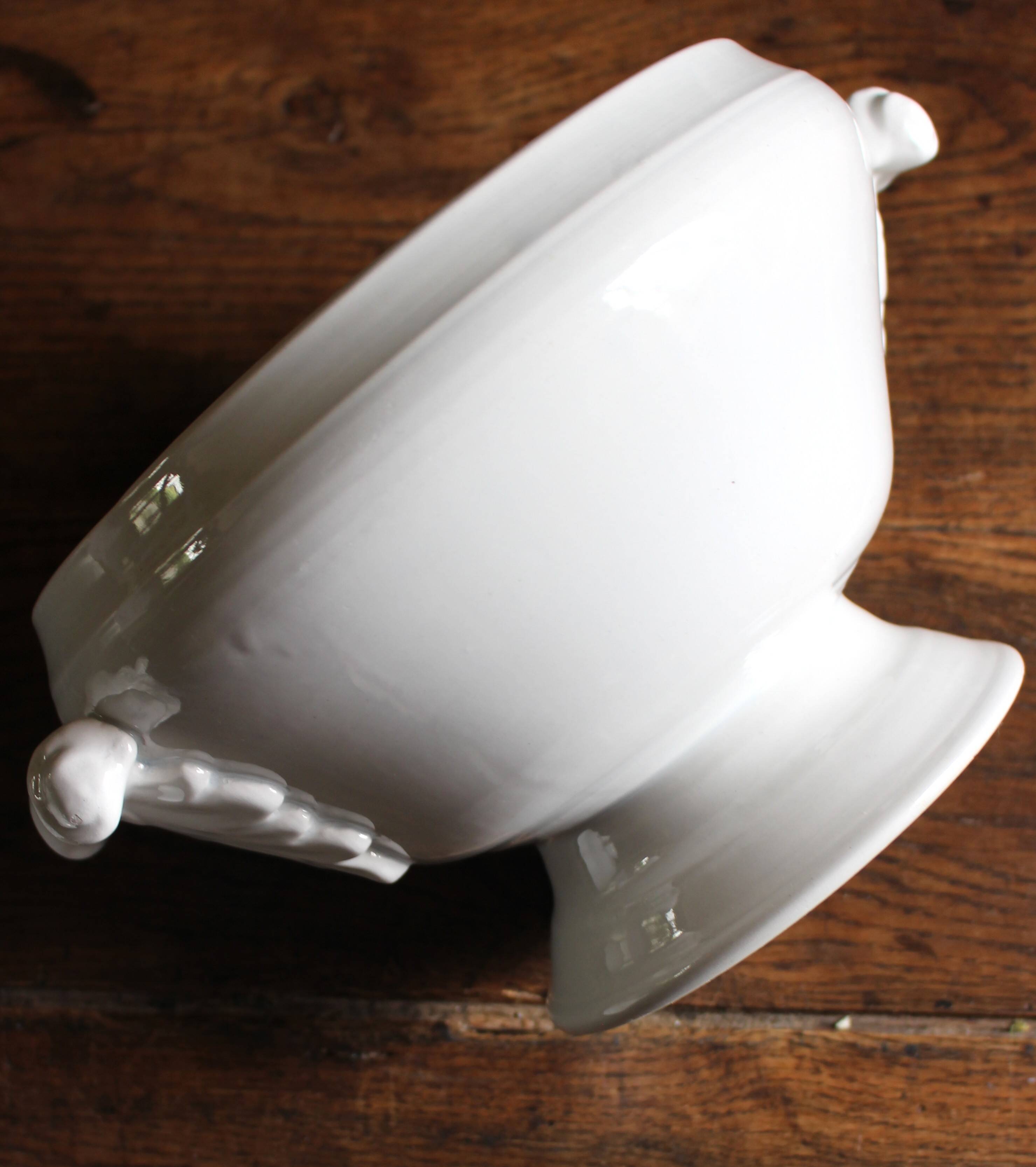 Antique soup tureen, white earthenware, with stopper decoration.