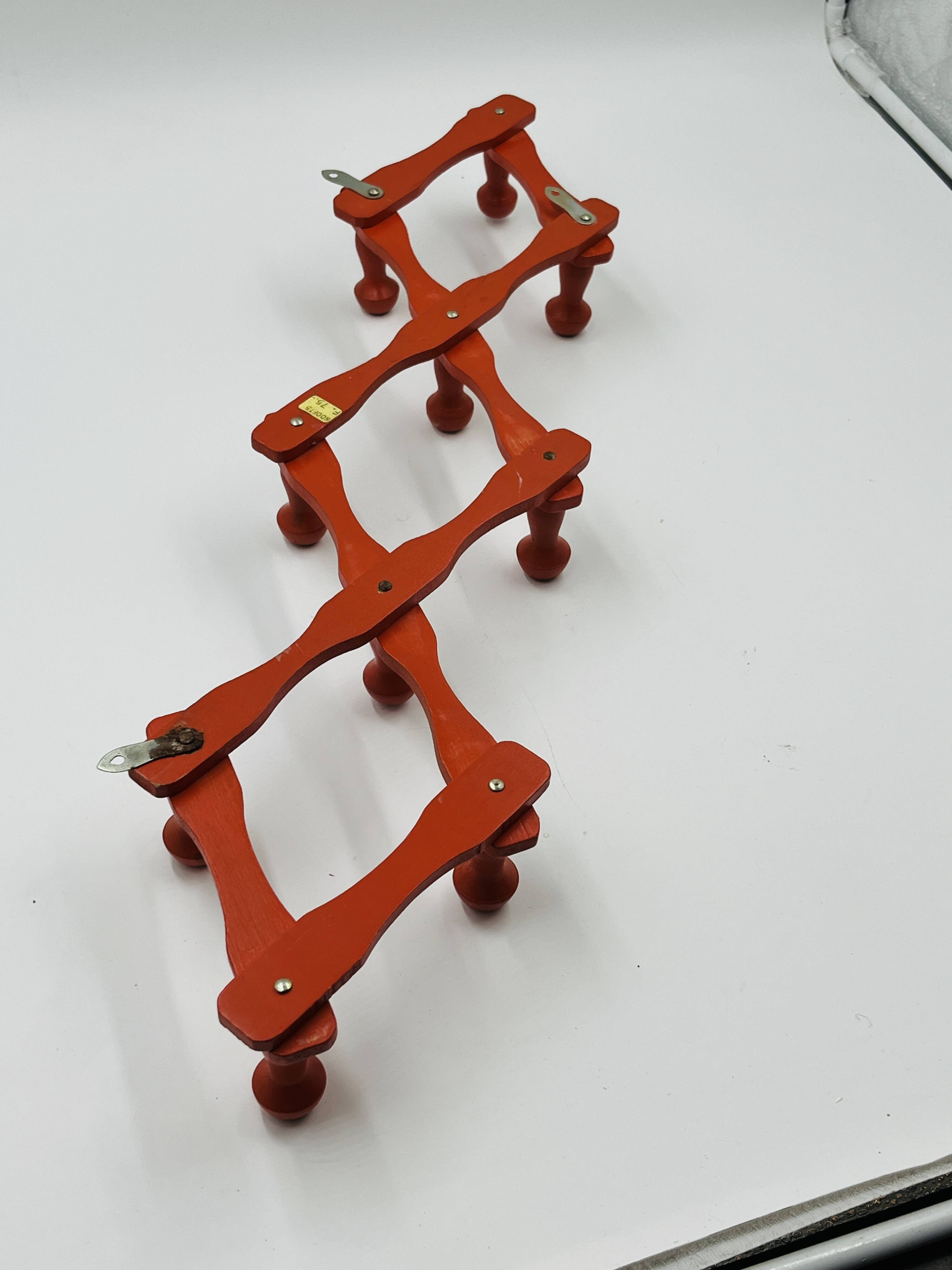 Vintage orange accordion coat rack