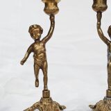 2 bougeoirs anciens chérubin en laiton