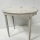 Art Deco style guéridon in patinated beech, 20th century.