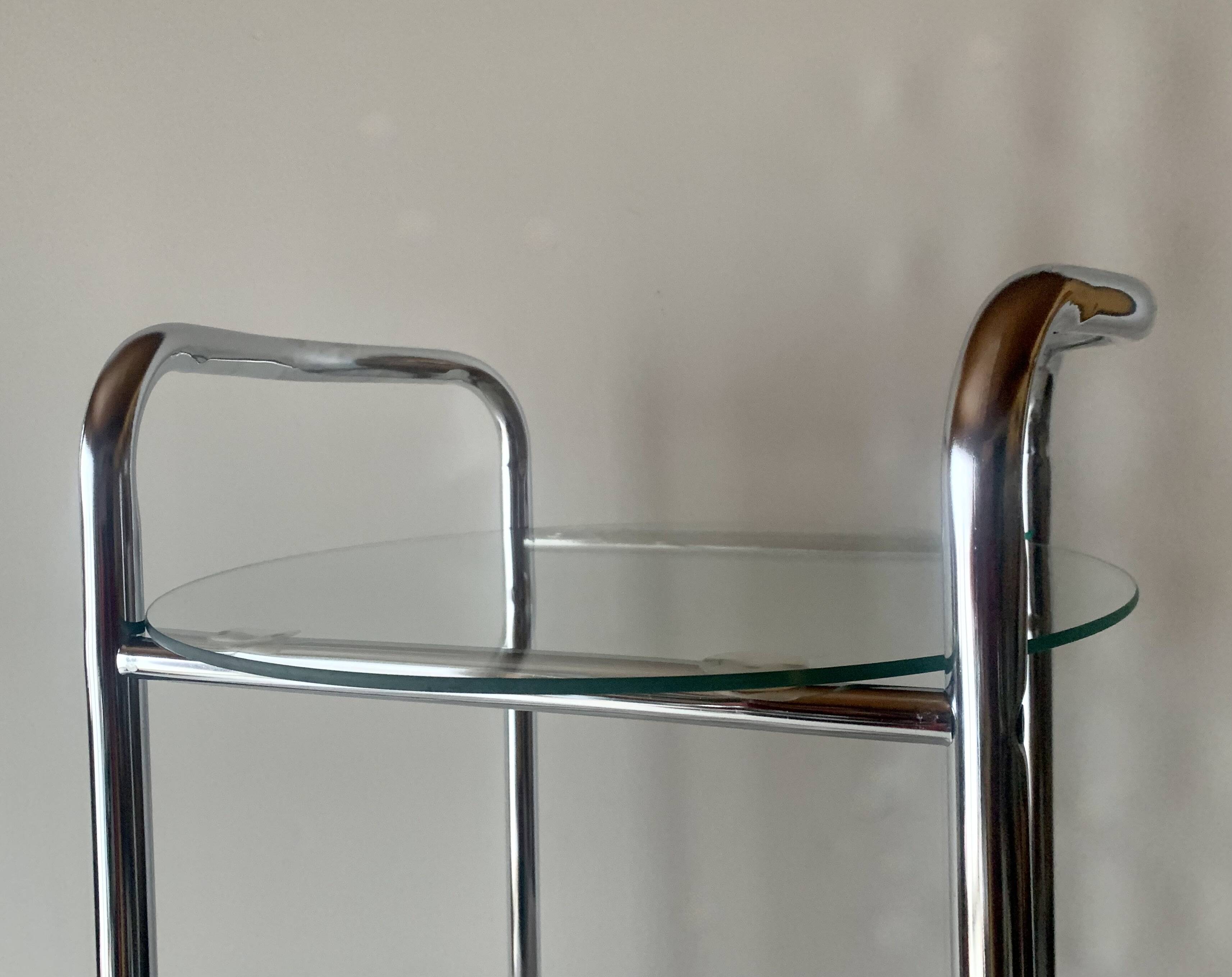 Pedestal table, vintage chrome steel saddle with 2 round windows