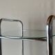 Pedestal table, vintage chrome steel saddle with 2 round windows