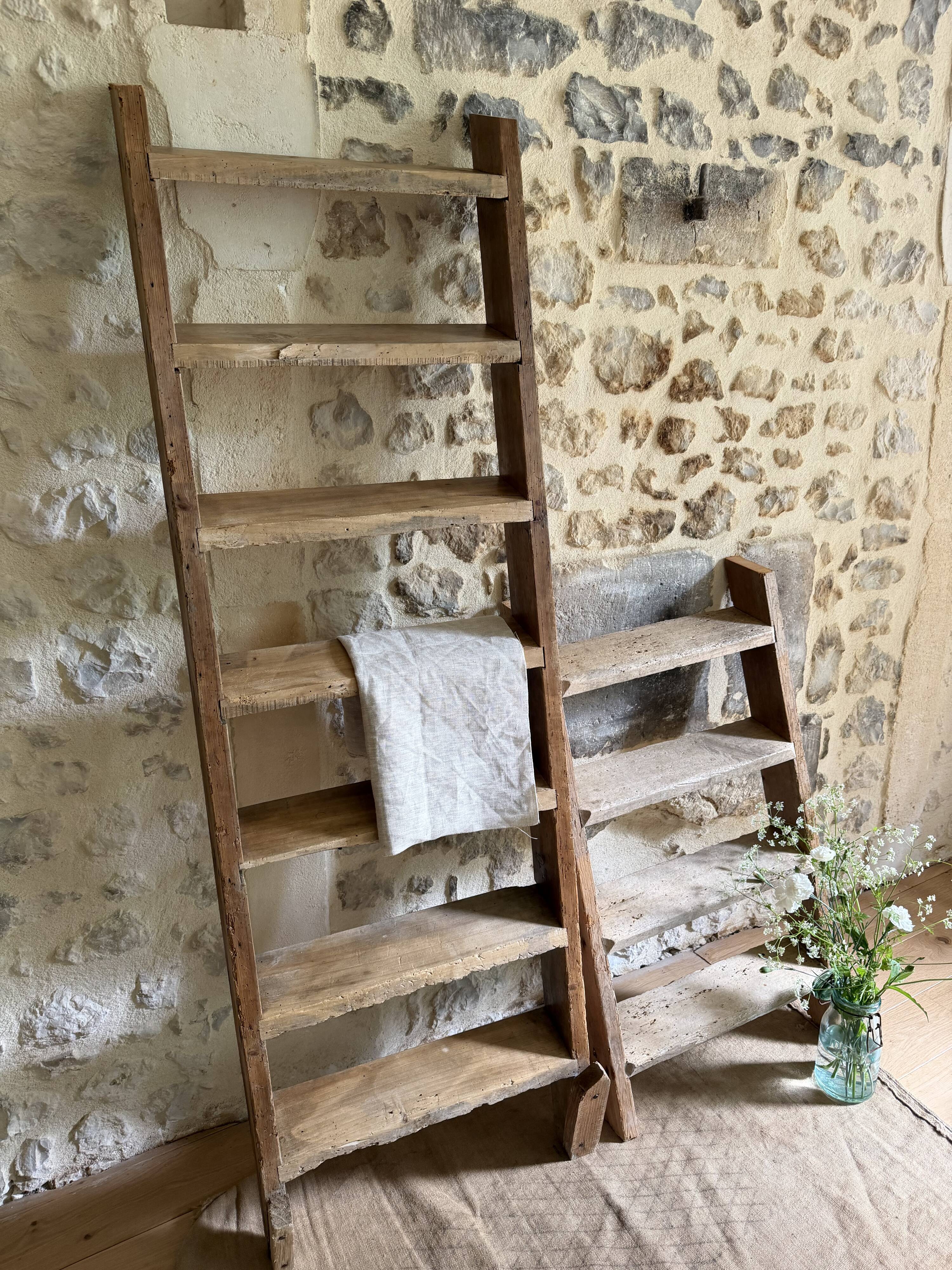Decorative wooden ladder or towel rack.