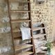 Decorative wooden ladder or towel rack.