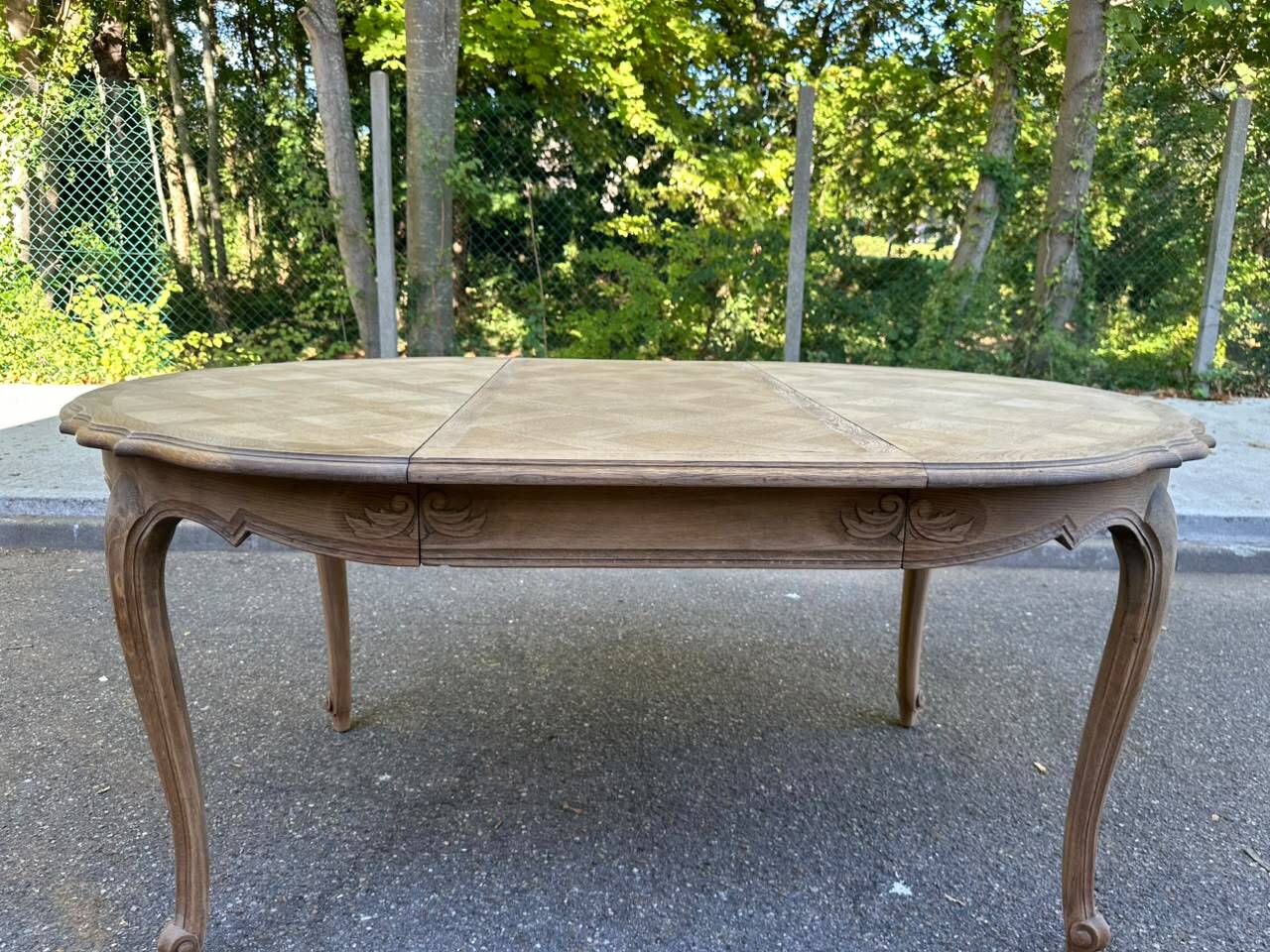 Round extendable dining table Louis XV stripped in solid oak 1950