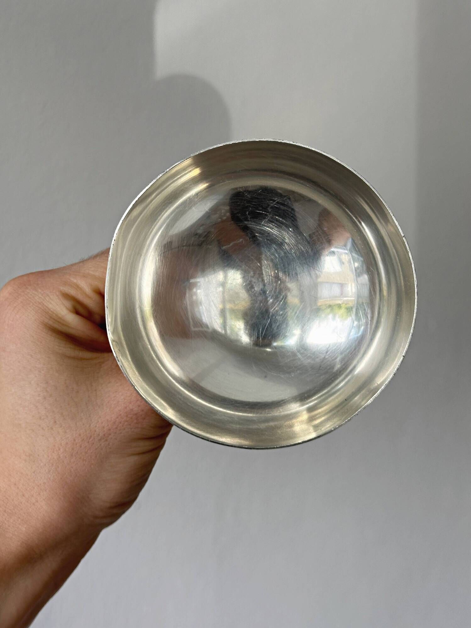 Silver-plated metal stand.