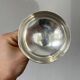 Silver-plated metal stand.