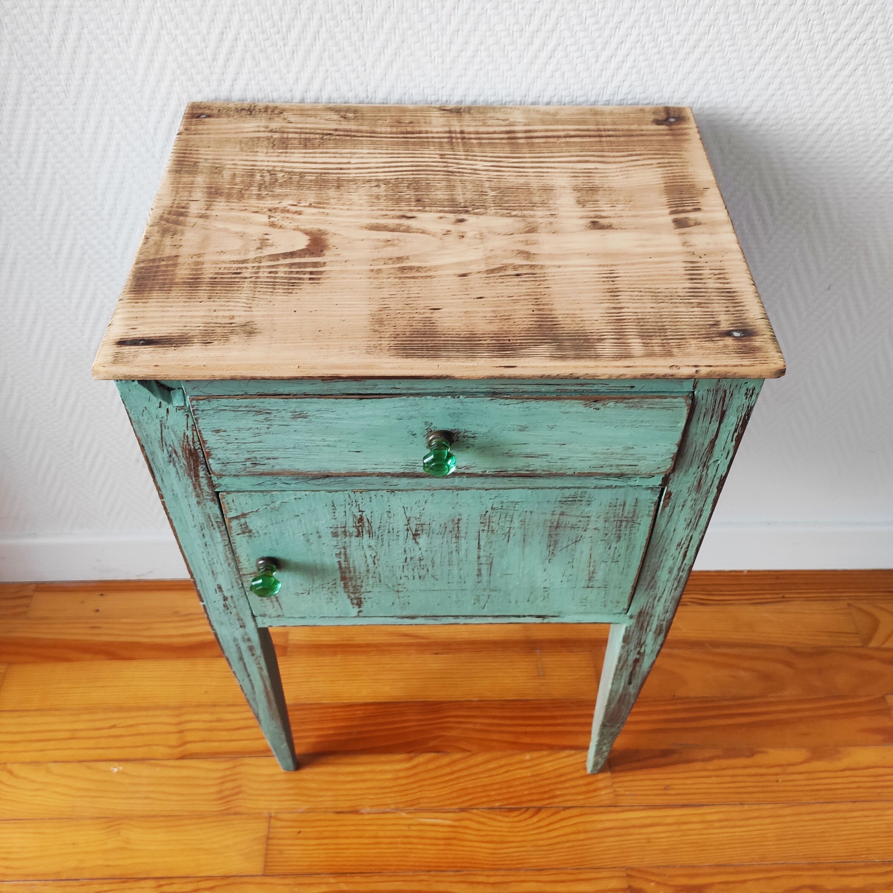 Patinated bedside table end of sofa