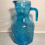Blue moulded pitcher with decorative handle