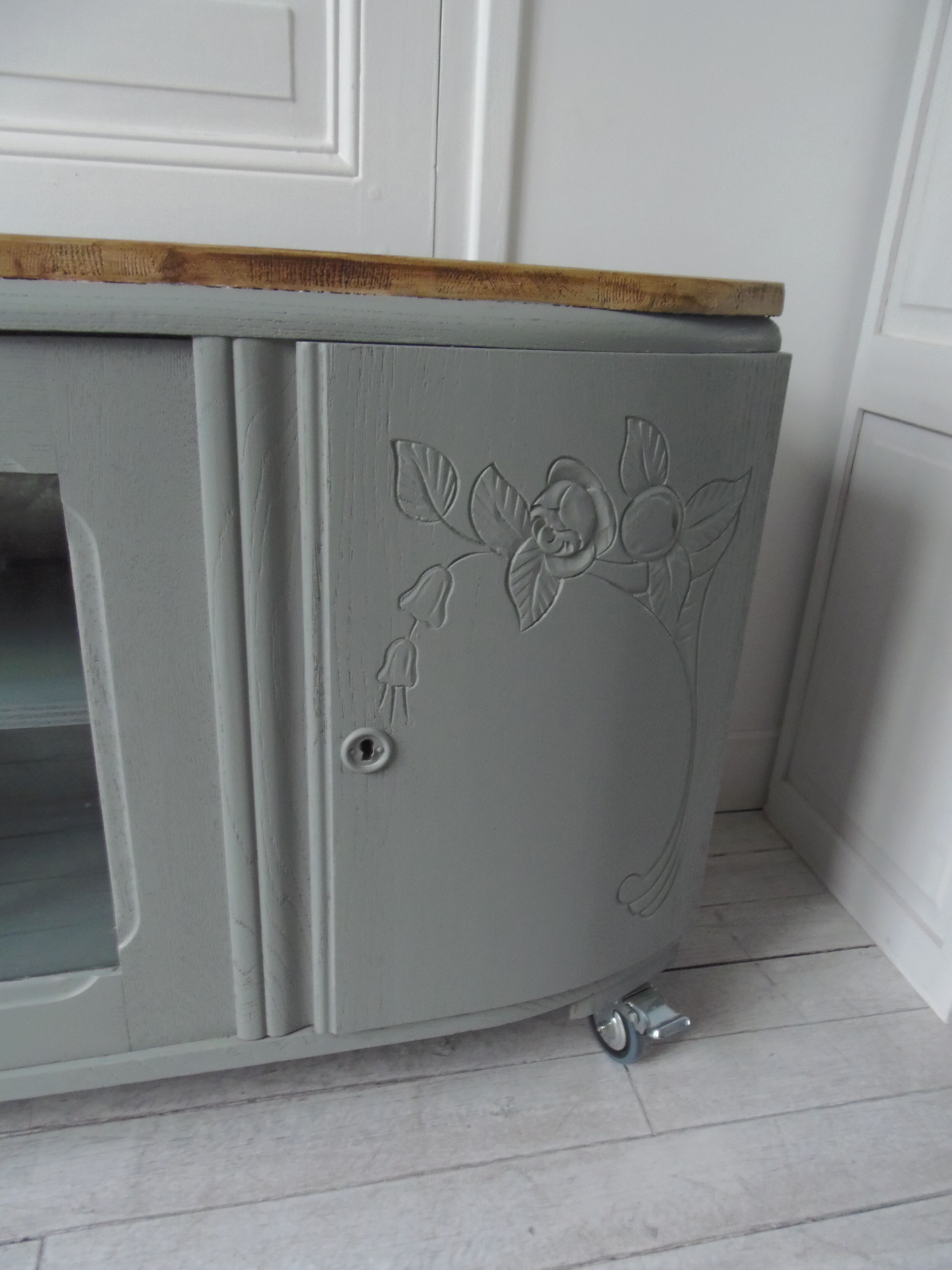 Art Deco furniture revisited in gray green and placed on wheels.