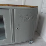 Art Deco furniture revisited in gray green and placed on wheels.