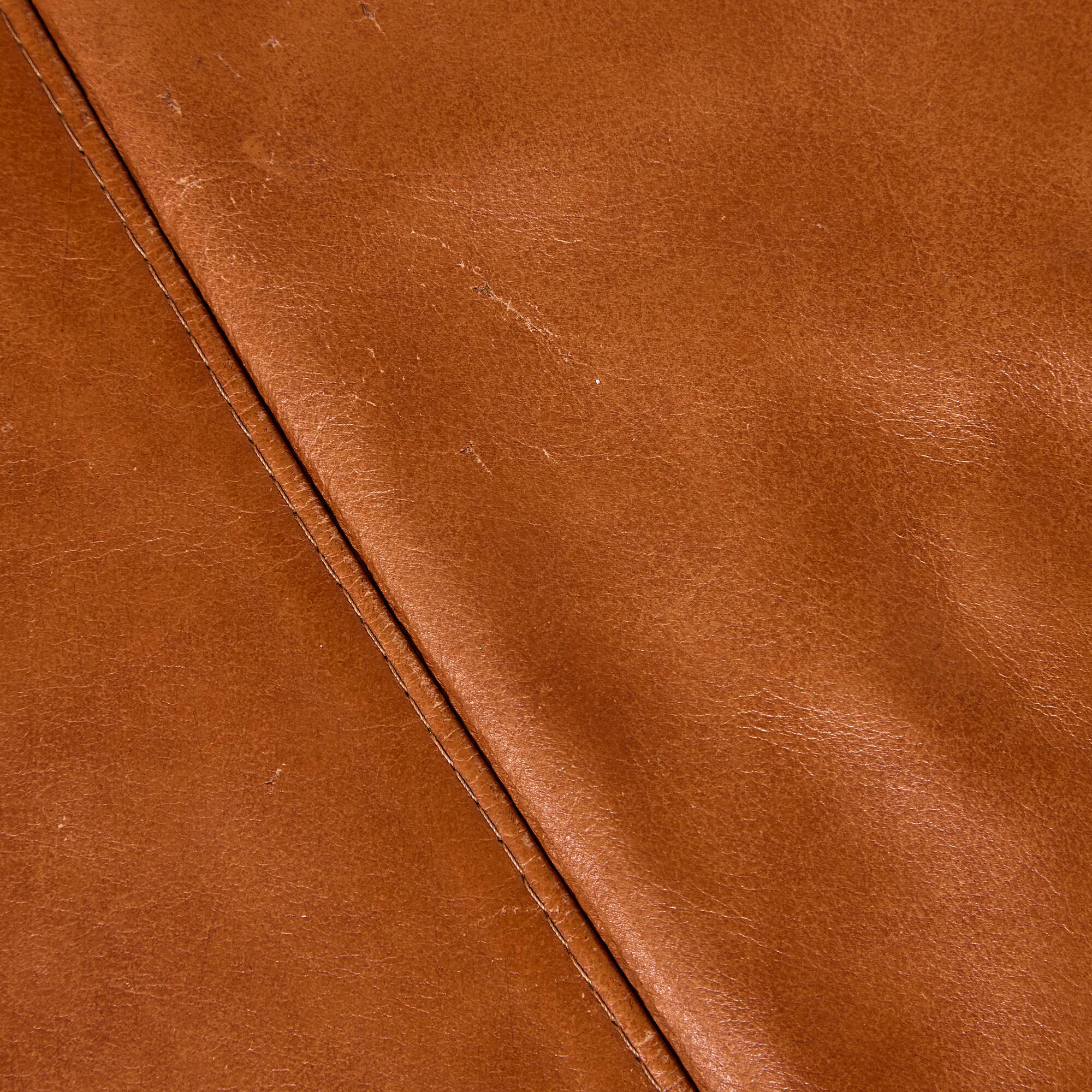 Ottoman with leather upholstery