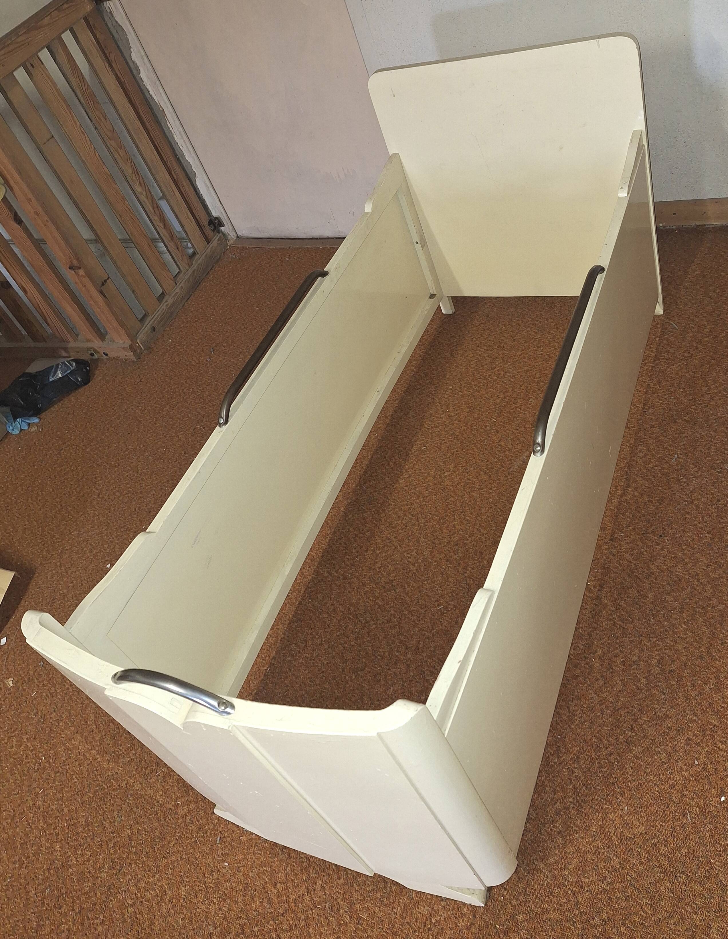 Painted wooden child's bed.