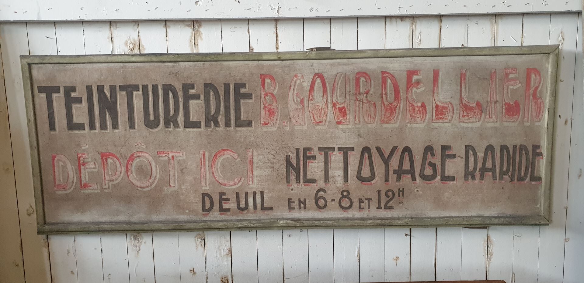former big wooden advertising sign