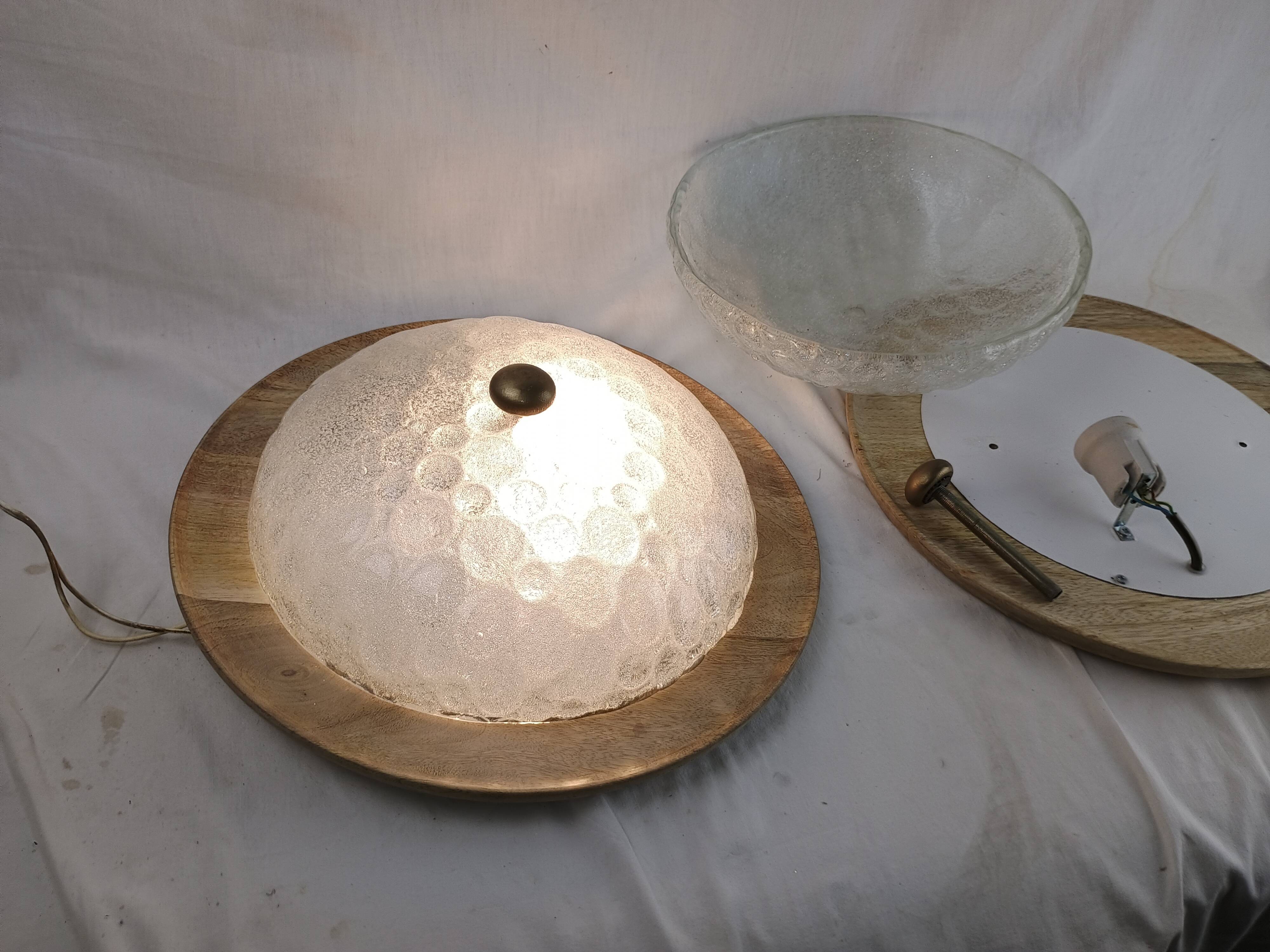 Pair of vintage Murano wall lights with exotic wood shelf.