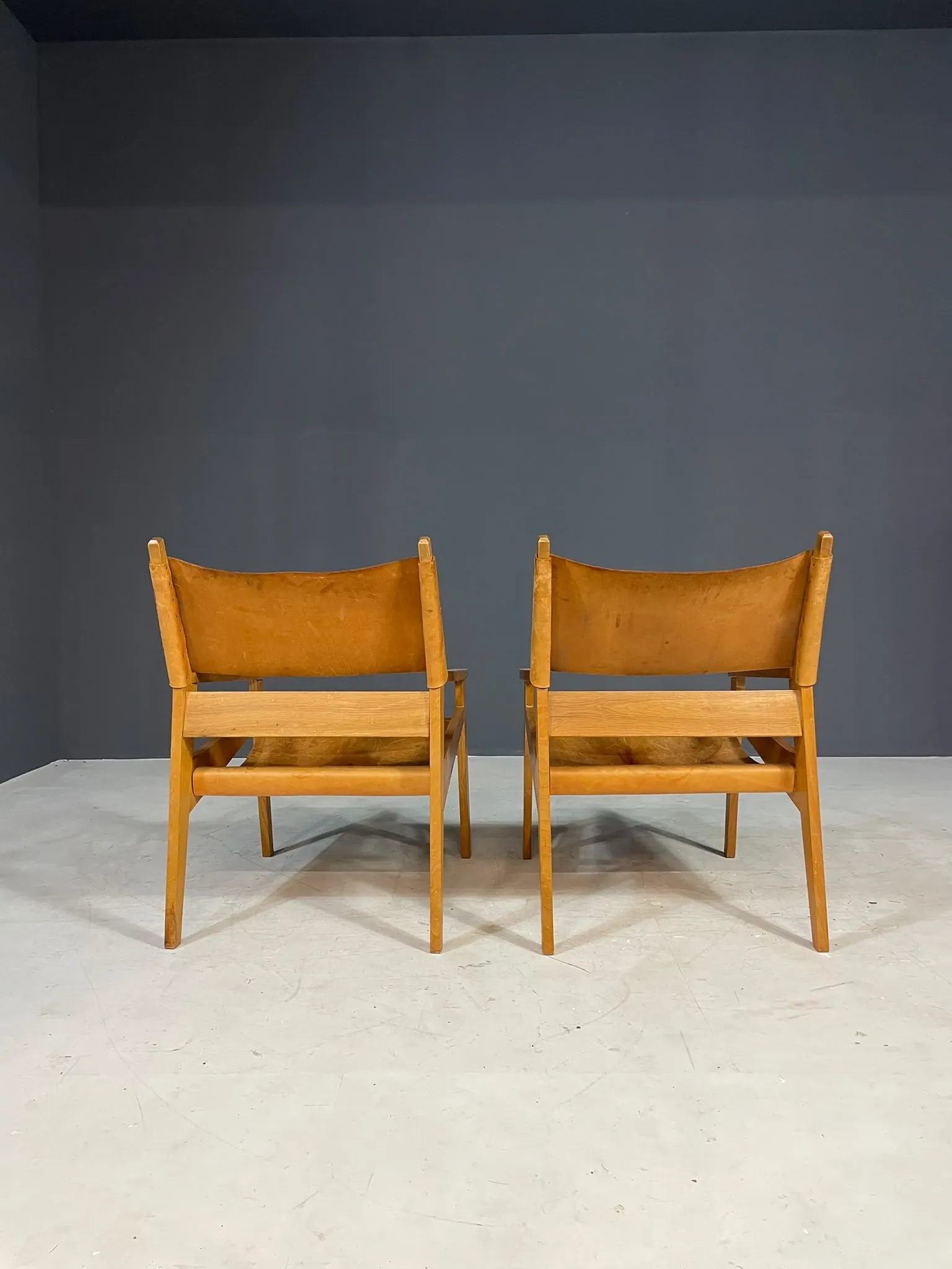 Pair of vintage wooden armchairs with leather upholstery, 20th century, 75 × 56 × 65 cm