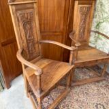 Pair of Renaissance style carved walnut armchairs