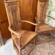 Pair of carved walnut armchairs in Renaissance style