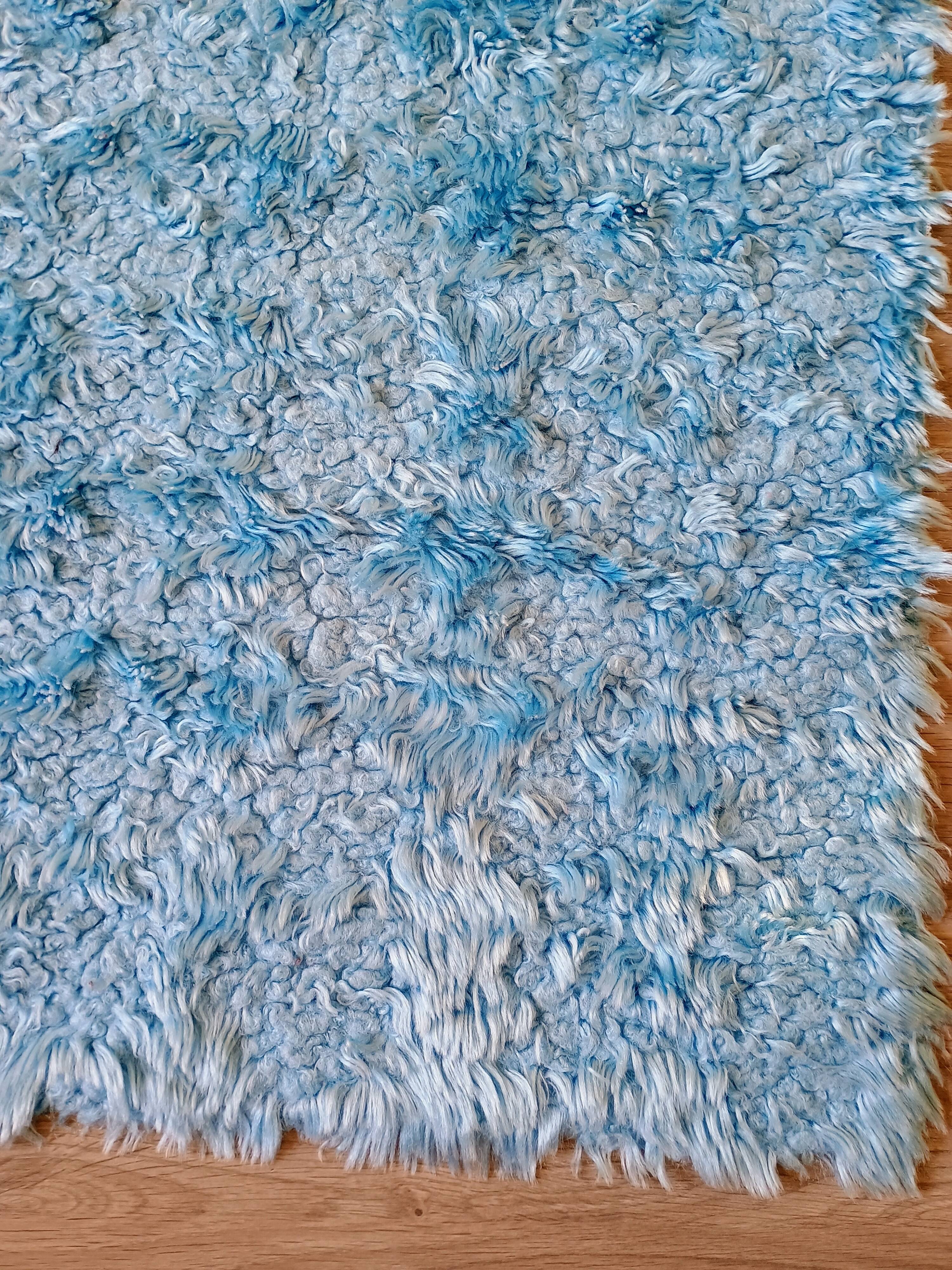 Set of two vintage sky blue rugs from the 70s
