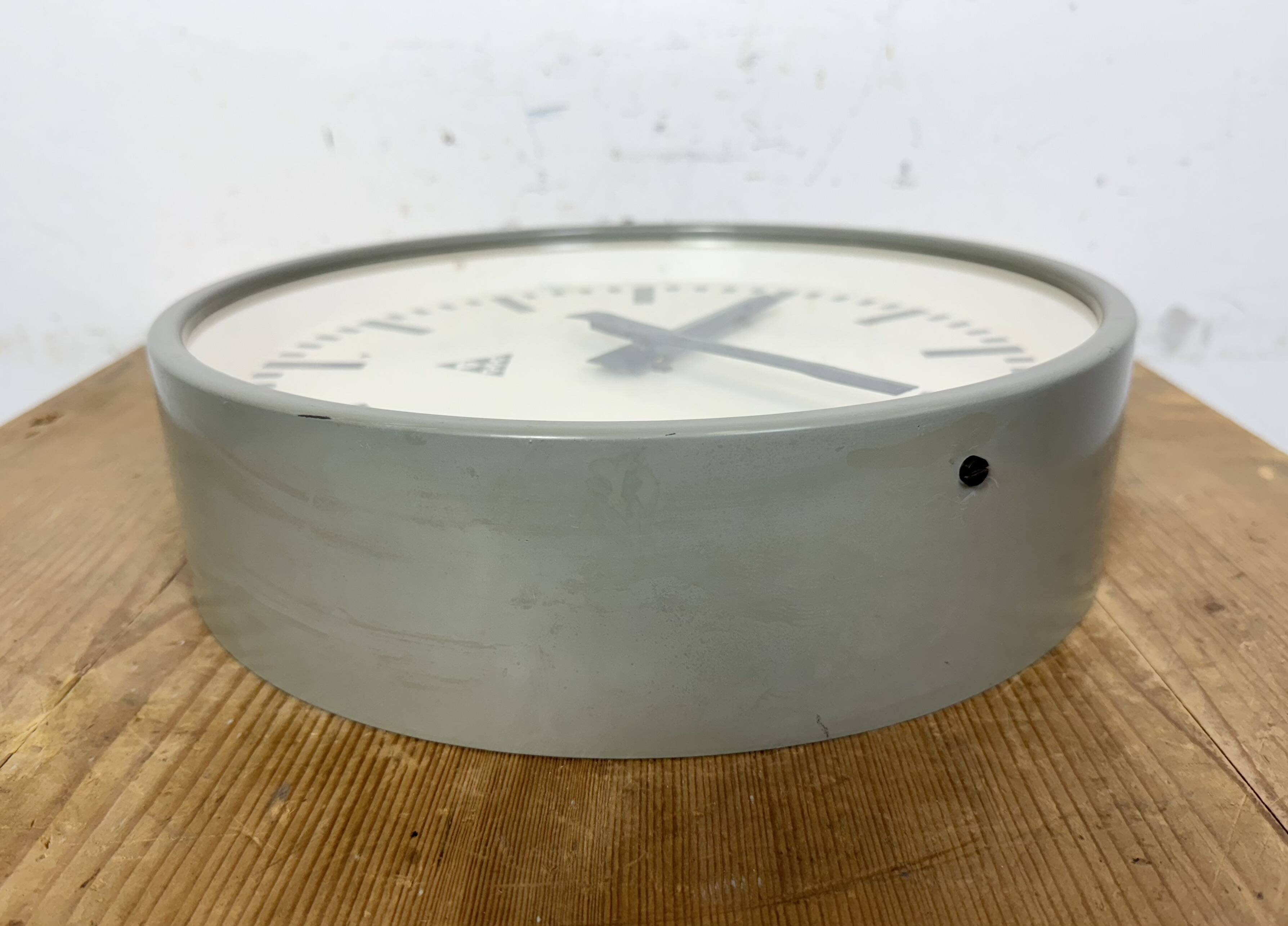 Industrial grey factory wall clock from pragotron, 1960s
