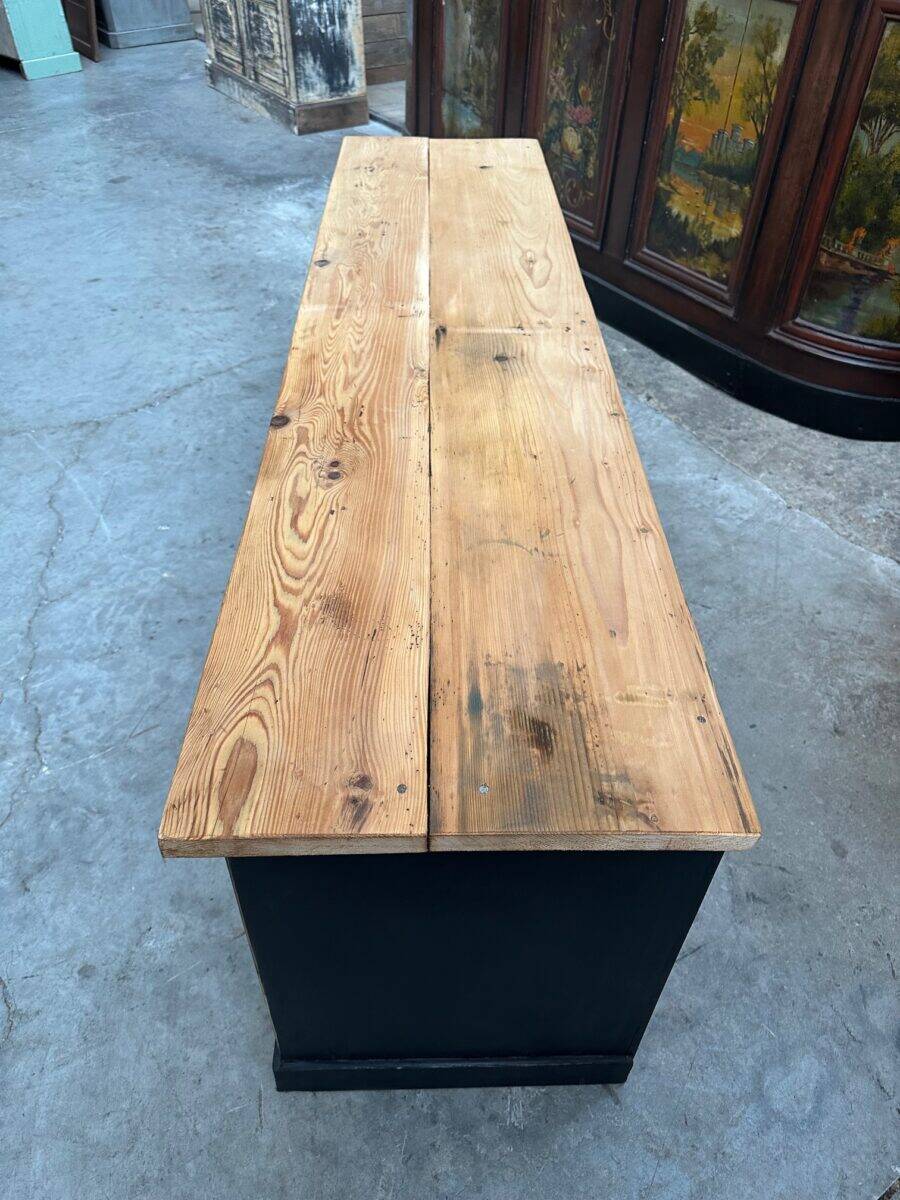 Old workshop furniture transformed into a TV unit.