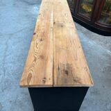 Old workshop furniture transformed into a TV unit.