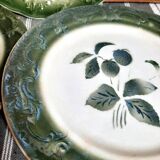 Antique earthenware plates with fruit decoration.