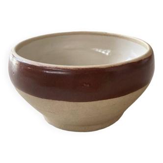 Old stoneware bowl with brown edge