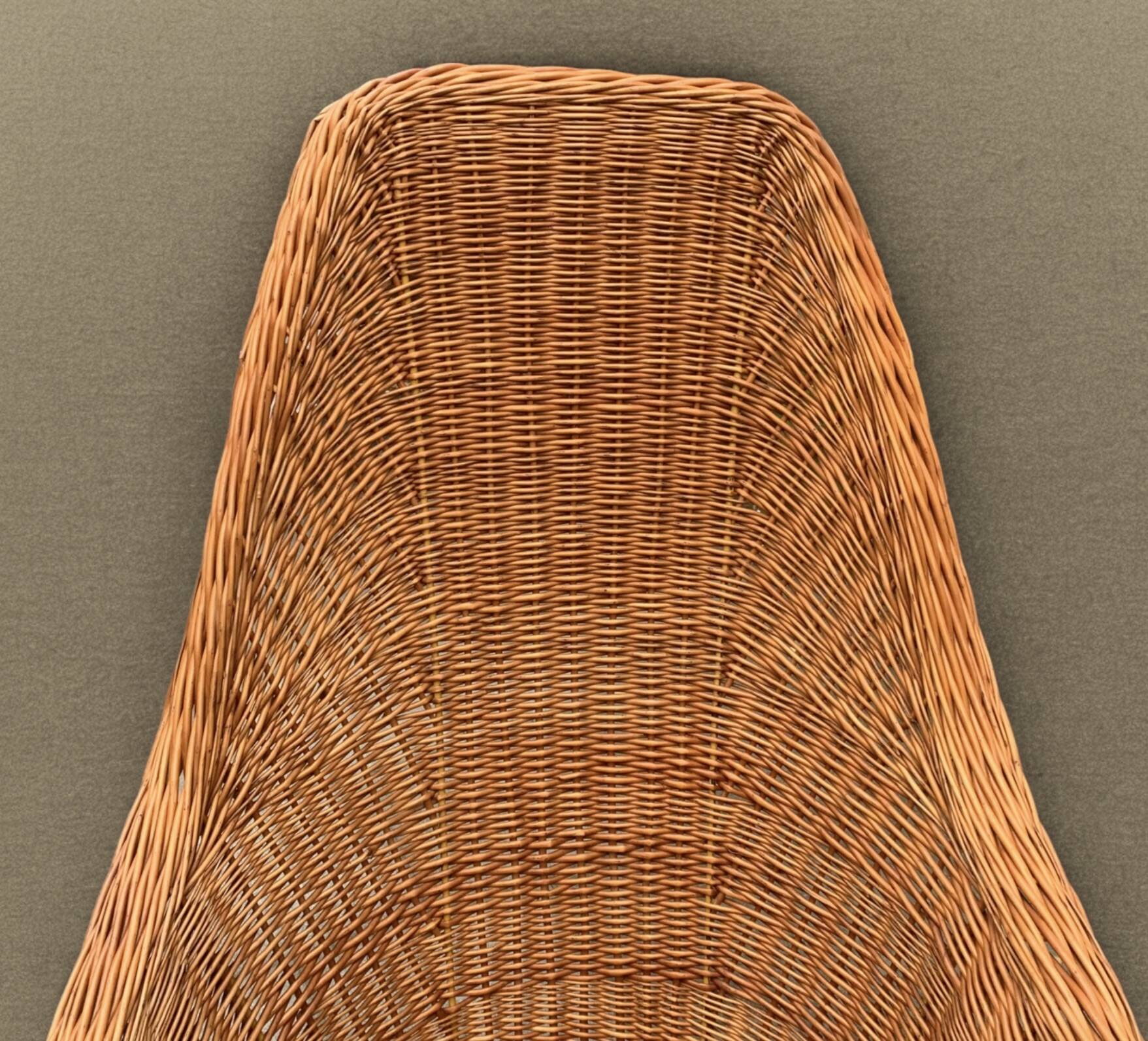 Vintage woven wicker armchair