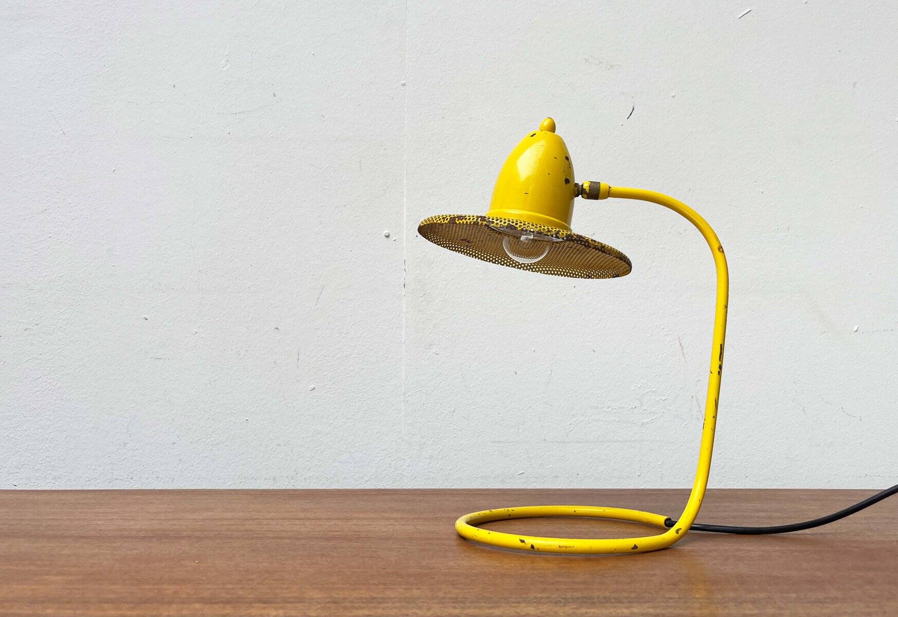 Perforated metal table lamp in Mid-Century Modern style, in the style of Mathieu Matégot, 1960s.