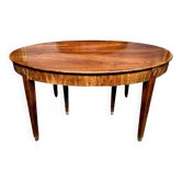 Table de style Empire. Placage de palissandre, bronze.