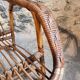 Vintage rattan lounge set, French wicker armchairs and round table, circa 1930–1950.