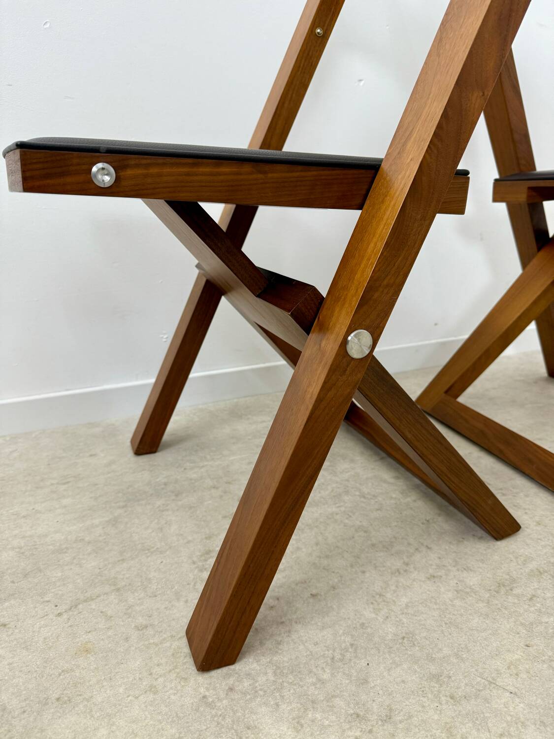 2 old folding chairs in wood and leather, postmodern design from the 80s vintage
