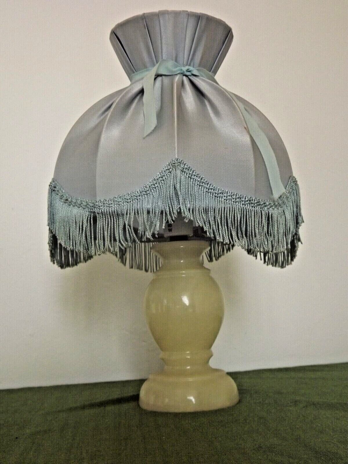 Pair of marble bedside lamps with blue satin fringed shades