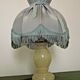 Pair of marble bedside lamps with blue satin fringed shades