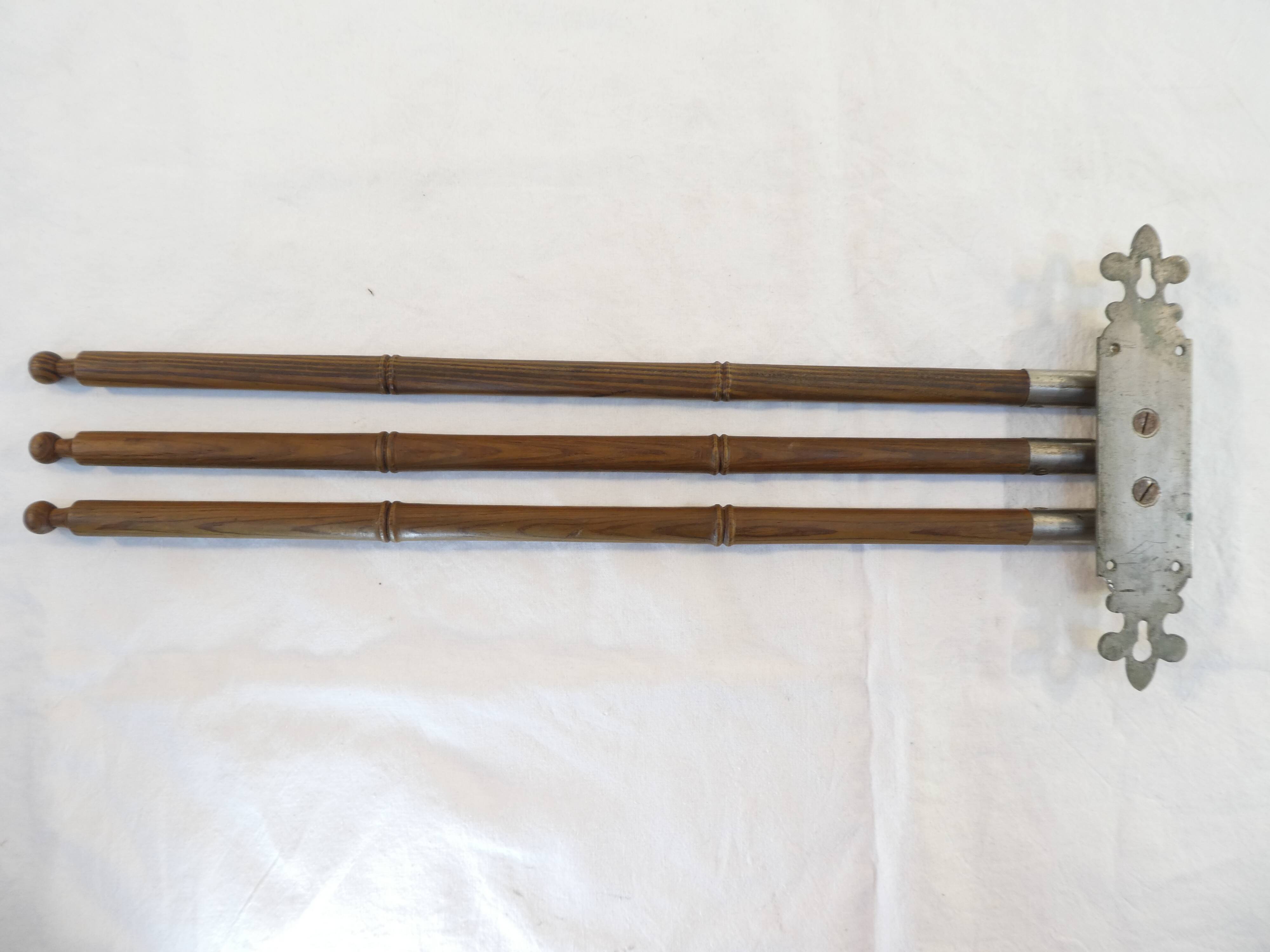Antique towel rack has three arms
