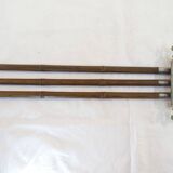 Antique towel rack has three arms
