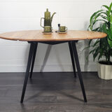Ercol round drop leaf dining table - black leg, 1960