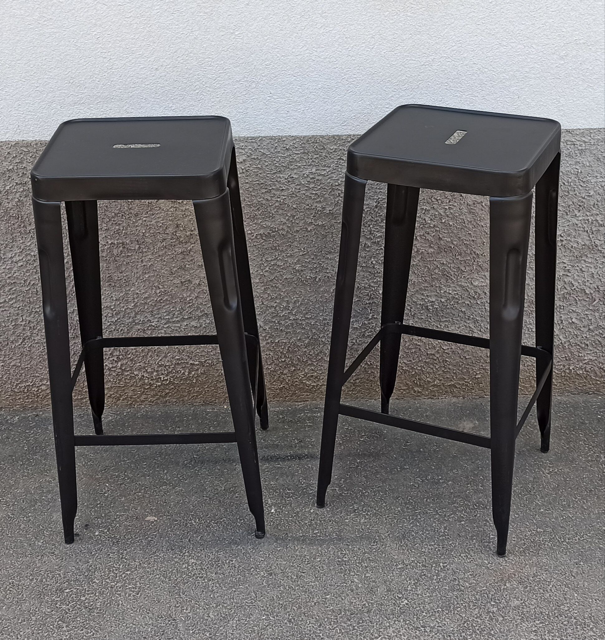 Pair of black metal stools